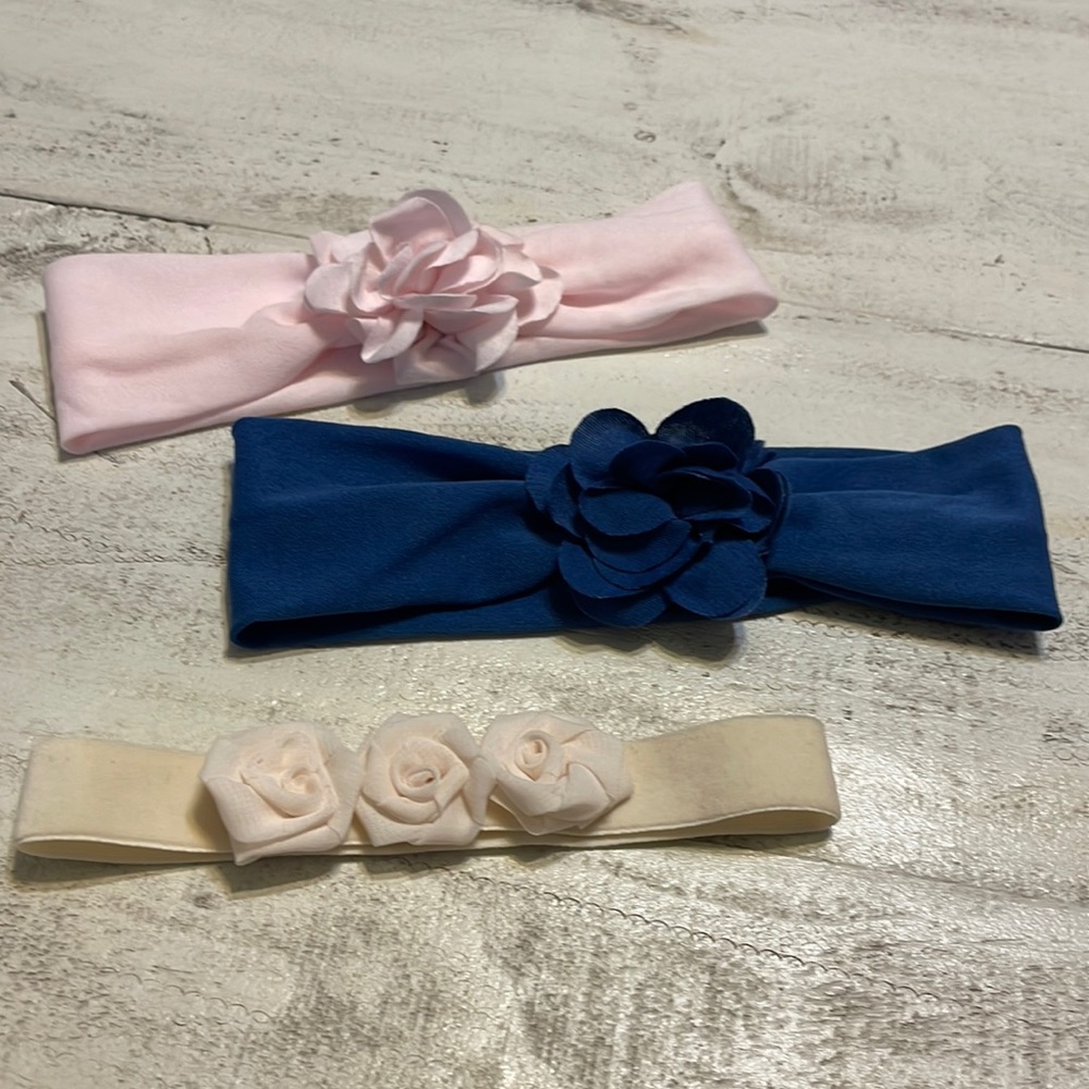 Lot of three soft baby girl headbands with flowers. Navy blue, pink and cream.